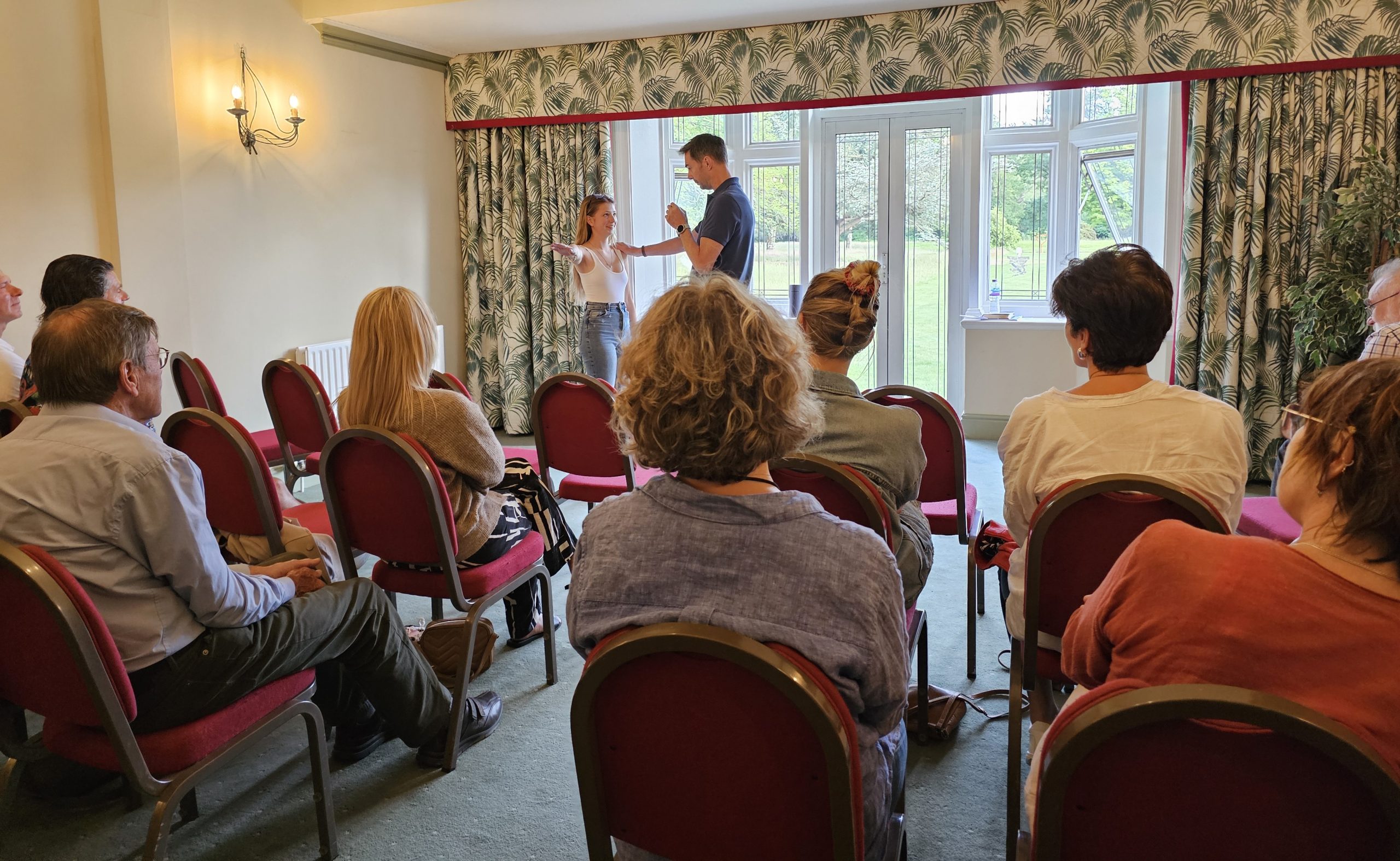 Terry Mellors presenting to a seated event audience